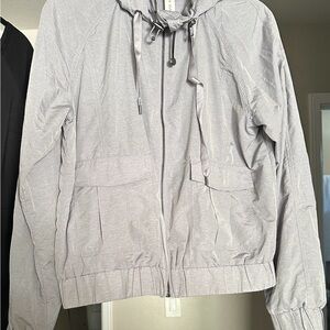 Lorna Jane Light Gray windbreaker, activewear, leisurewear jacket with hood.